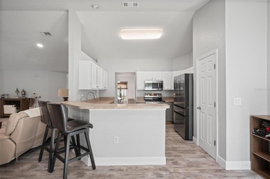 Soft views of surrounding trees create a tranquil backdrop for on Bobcat Trail Golf Club in Florida - for sale on GolfHomes.com, golf home, golf lot