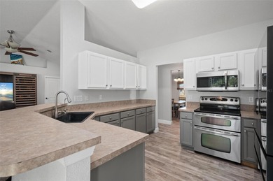 Soft views of surrounding trees create a tranquil backdrop for on Bobcat Trail Golf Club in Florida - for sale on GolfHomes.com, golf home, golf lot