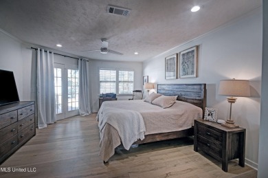 Discover modern comfort and golf course living in this on Bay Pointe Golf and Resort in Mississippi - for sale on GolfHomes.com, golf home, golf lot