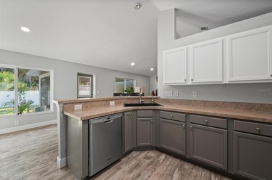 Soft views of surrounding trees create a tranquil backdrop for on Bobcat Trail Golf Club in Florida - for sale on GolfHomes.com, golf home, golf lot