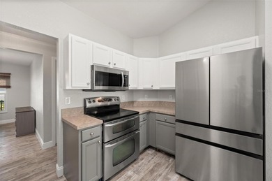 Soft views of surrounding trees create a tranquil backdrop for on Bobcat Trail Golf Club in Florida - for sale on GolfHomes.com, golf home, golf lot