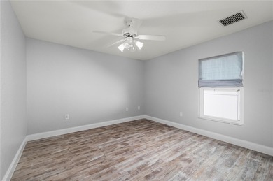 Soft views of surrounding trees create a tranquil backdrop for on Bobcat Trail Golf Club in Florida - for sale on GolfHomes.com, golf home, golf lot