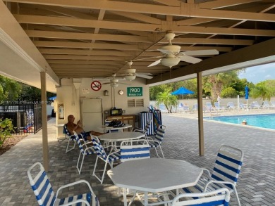 WATER VIEW! 2 BED, 2 BATH GROUND FLOOR UNIT. WASHER AND DRYER on Inverrary Country Club in Florida - for sale on GolfHomes.com, golf home, golf lot