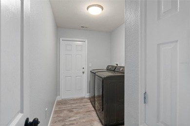 Soft views of surrounding trees create a tranquil backdrop for on Bobcat Trail Golf Club in Florida - for sale on GolfHomes.com, golf home, golf lot