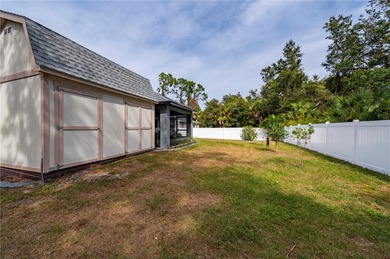 Soft views of surrounding trees create a tranquil backdrop for on Bobcat Trail Golf Club in Florida - for sale on GolfHomes.com, golf home, golf lot