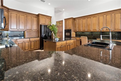 Tucked within the prestigious guard-gated Silverthorn Golf on Silverthorn Country Club in Florida - for sale on GolfHomes.com, golf home, golf lot