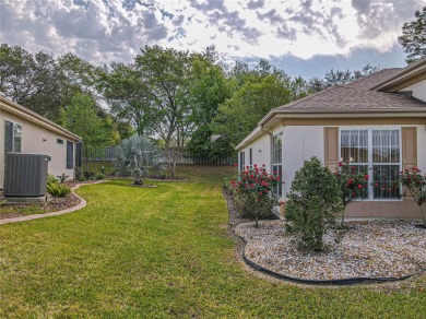Fabulous Santa Rosa model boasts brick pavers on driveway and on Eagle Ridge At Spruce Creek Country Club in Florida - for sale on GolfHomes.com, golf home, golf lot