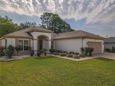 Fabulous Santa Rosa model boasts brick pavers on driveway and on Eagle Ridge At Spruce Creek Country Club in Florida - for sale on GolfHomes.com, golf home, golf lot