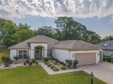Fabulous Santa Rosa model boasts brick pavers on driveway and on Eagle Ridge At Spruce Creek Country Club in Florida - for sale on GolfHomes.com, golf home, golf lot