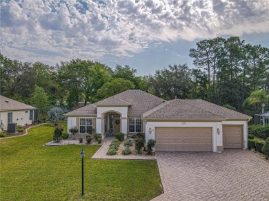 Fabulous Santa Rosa model boasts brick pavers on driveway and on Eagle Ridge At Spruce Creek Country Club in Florida - for sale on GolfHomes.com, golf home, golf lot
