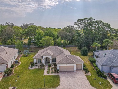 Fabulous Santa Rosa model boasts brick pavers on driveway and on Eagle Ridge At Spruce Creek Country Club in Florida - for sale on GolfHomes.com, golf home, golf lot