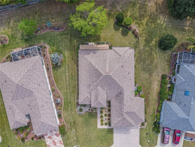 Fabulous Santa Rosa model boasts brick pavers on driveway and on Eagle Ridge At Spruce Creek Country Club in Florida - for sale on GolfHomes.com, golf home, golf lot