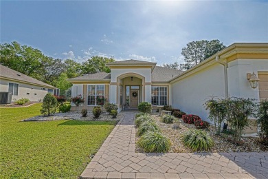 Fabulous Santa Rosa model boasts brick pavers on driveway and on Eagle Ridge At Spruce Creek Country Club in Florida - for sale on GolfHomes.com, golf home, golf lot