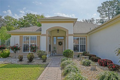 Fabulous Santa Rosa model boasts brick pavers on driveway and on Eagle Ridge At Spruce Creek Country Club in Florida - for sale on GolfHomes.com, golf home, golf lot
