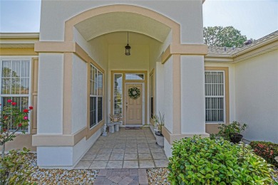 Fabulous Santa Rosa model boasts brick pavers on driveway and on Eagle Ridge At Spruce Creek Country Club in Florida - for sale on GolfHomes.com, golf home, golf lot
