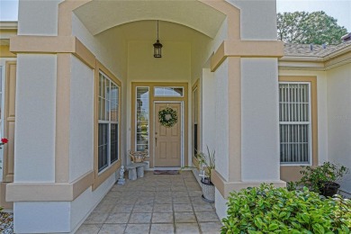 Fabulous Santa Rosa model boasts brick pavers on driveway and on Eagle Ridge At Spruce Creek Country Club in Florida - for sale on GolfHomes.com, golf home, golf lot