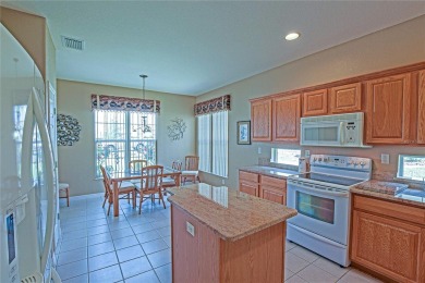 Fabulous Santa Rosa model boasts brick pavers on driveway and on Eagle Ridge At Spruce Creek Country Club in Florida - for sale on GolfHomes.com, golf home, golf lot