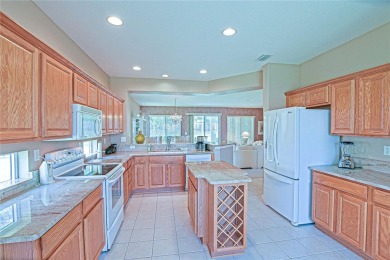 Fabulous Santa Rosa model boasts brick pavers on driveway and on Eagle Ridge At Spruce Creek Country Club in Florida - for sale on GolfHomes.com, golf home, golf lot