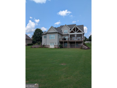 Welcome home - a charming 5 bedroom, 3.5 bath, Craftsman home on Traditions of Braselton Golf Club in Georgia - for sale on GolfHomes.com, golf home, golf lot