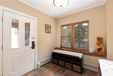 Rare 4-bedroom end unit townhome with warm wood accents and a on The River Course At Keystone in Colorado - for sale on GolfHomes.com, golf home, golf lot