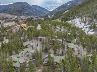 Rare 4-bedroom end unit townhome with warm wood accents and a on The River Course At Keystone in Colorado - for sale on GolfHomes.com, golf home, golf lot