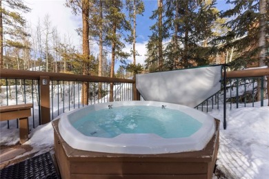 Rare 4-bedroom end unit townhome with warm wood accents and a on The River Course At Keystone in Colorado - for sale on GolfHomes.com, golf home, golf lot