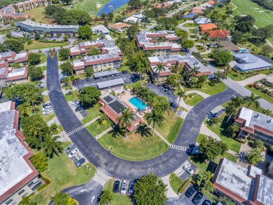 Lovely 2 bedroom and 2 bathroom condo location on the 1nd floor on BallenIsles Golf and Country Club in Florida - for sale on GolfHomes.com, golf home, golf lot