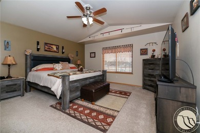 Beautifully maintained 5-bedroom, 3-bath home backing to Lake on Lake Hills Golf Course in Montana - for sale on GolfHomes.com, golf home, golf lot