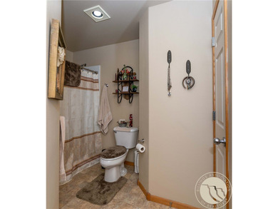 Beautifully maintained 5-bedroom, 3-bath home backing to Lake on Lake Hills Golf Course in Montana - for sale on GolfHomes.com, golf home, golf lot