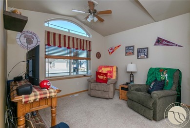 Beautifully maintained 5-bedroom, 3-bath home backing to Lake on Lake Hills Golf Course in Montana - for sale on GolfHomes.com, golf home, golf lot