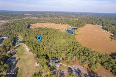 Larger 5 acre lot parcel heavily wooded adjacent to the Ocean on Sea Trail Golf Resort in North Carolina - for sale on GolfHomes.com, golf home, golf lot