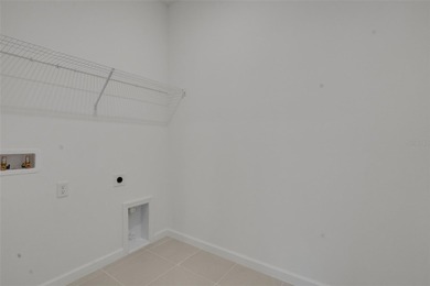 One or more photo(s) has been virtually staged. Poinciana on Fishermans Cove Golf and Marina in Florida - for sale on GolfHomes.com, golf home, golf lot