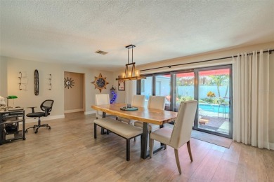 Under contract-accepting backup offers. Must-See Dunedin Pool on The Dunedin Country Club in Florida - for sale on GolfHomes.com, golf home, golf lot