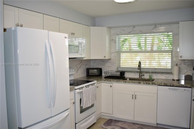 This large ground floor 2/2 is tastefully done and meticulously on Sunrise Lakes Phase IV Golf Course in Florida - for sale on GolfHomes.com, golf home, golf lot