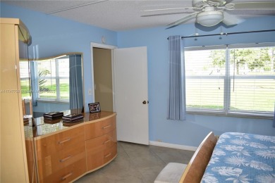 This large ground floor 2/2 is tastefully done and meticulously on Sunrise Lakes Phase IV Golf Course in Florida - for sale on GolfHomes.com, golf home, golf lot