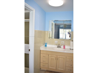 This large ground floor 2/2 is tastefully done and meticulously on Sunrise Lakes Phase IV Golf Course in Florida - for sale on GolfHomes.com, golf home, golf lot