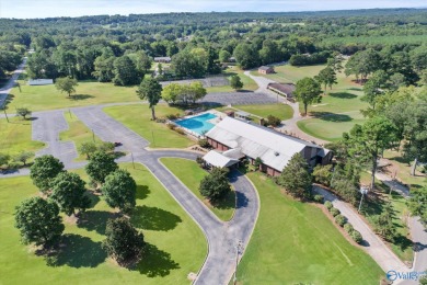 Discover golf course living at its finest with this stunning on Burningtree Country Club in Alabama - for sale on GolfHomes.com, golf home, golf lot