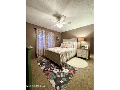 Beautifully updated 4 bedroom home is walking distance to the on Castlewoods Golf Club in Mississippi - for sale on GolfHomes.com, golf home, golf lot