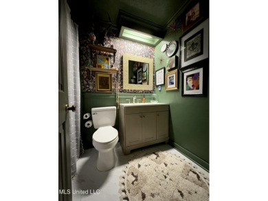 Beautifully updated 4 bedroom home is walking distance to the on Castlewoods Golf Club in Mississippi - for sale on GolfHomes.com, golf home, golf lot