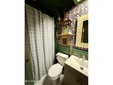 Beautifully updated 4 bedroom home is walking distance to the on Castlewoods Golf Club in Mississippi - for sale on GolfHomes.com, golf home, golf lot