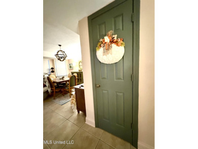 Beautifully updated 4 bedroom home is walking distance to the on Castlewoods Golf Club in Mississippi - for sale on GolfHomes.com, golf home, golf lot