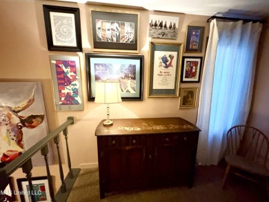 Beautifully updated 4 bedroom home is walking distance to the on Castlewoods Golf Club in Mississippi - for sale on GolfHomes.com, golf home, golf lot