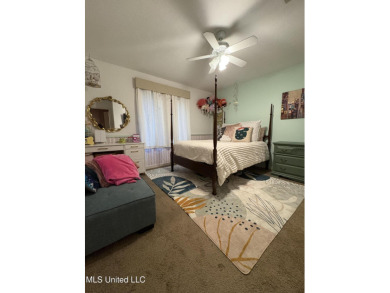 Beautifully updated 4 bedroom home is walking distance to the on Castlewoods Golf Club in Mississippi - for sale on GolfHomes.com, golf home, golf lot