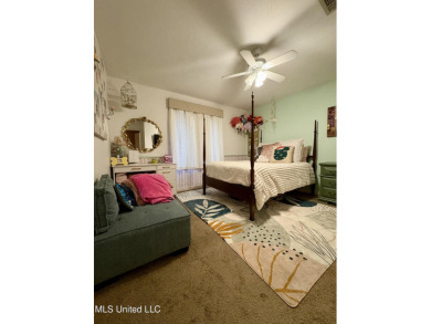 Beautifully updated 4 bedroom home is walking distance to the on Castlewoods Golf Club in Mississippi - for sale on GolfHomes.com, golf home, golf lot