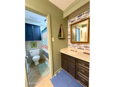 Beautifully updated 4 bedroom home is walking distance to the on Castlewoods Golf Club in Mississippi - for sale on GolfHomes.com, golf home, golf lot