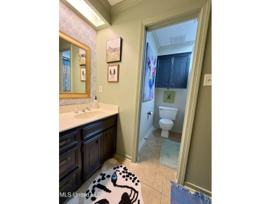 Beautifully updated 4 bedroom home is walking distance to the on Castlewoods Golf Club in Mississippi - for sale on GolfHomes.com, golf home, golf lot