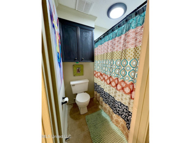 Beautifully updated 4 bedroom home is walking distance to the on Castlewoods Golf Club in Mississippi - for sale on GolfHomes.com, golf home, golf lot