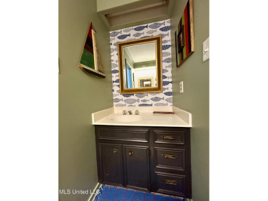 Beautifully updated 4 bedroom home is walking distance to the on Castlewoods Golf Club in Mississippi - for sale on GolfHomes.com, golf home, golf lot