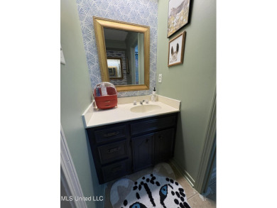 Beautifully updated 4 bedroom home is walking distance to the on Castlewoods Golf Club in Mississippi - for sale on GolfHomes.com, golf home, golf lot