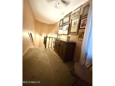 Beautifully updated 4 bedroom home is walking distance to the on Castlewoods Golf Club in Mississippi - for sale on GolfHomes.com, golf home, golf lot
